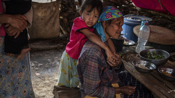 A girl hugs ger grandmother at an IDP camp. Escalating conflict across Myanmar is driving displacement to unprecedented levels: as of June 2024, 3 million people were displaced; this is equivalent to the original full-year projected total for 2024.