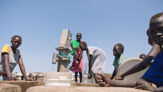 Displaced people collect water from a water point funded by the Central Emergency Response Fund in Kuermandoke area in the Bentiu IDP site B in Rubkona County.